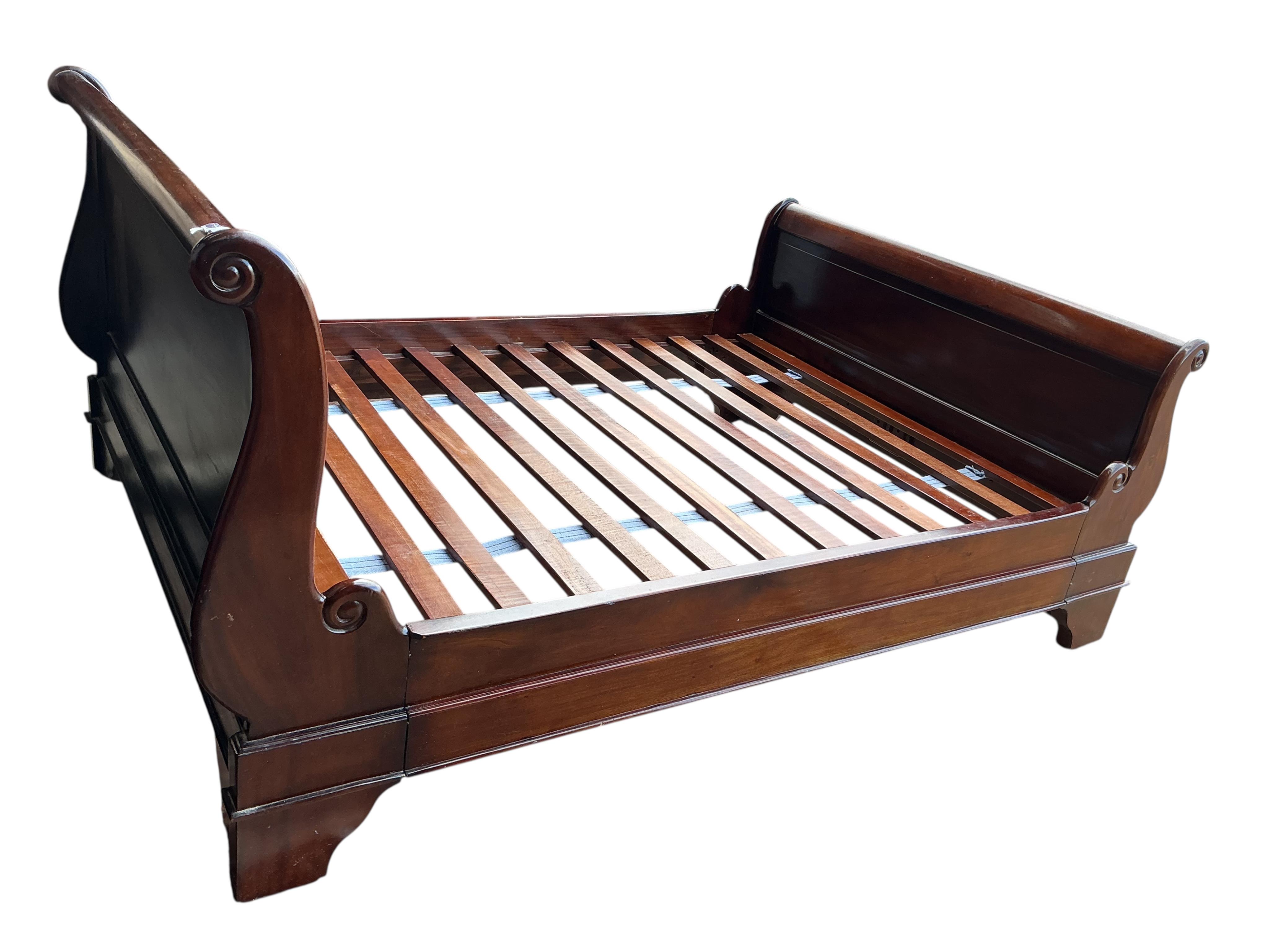 A reproduction mahogany sleigh bed, width 144cm, height 99cm